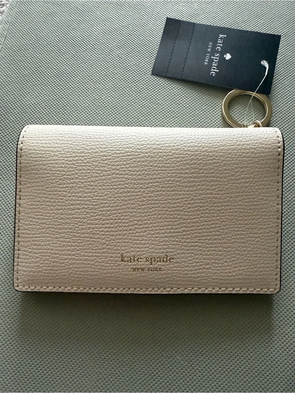kate spade cream pebble leather card case with gold keyring